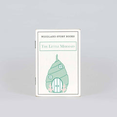 Book titled 'The Little Mermaid' from Woodland Story Books on a light gray background