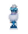 Toy figure with blue outfit and white hat on a plain background