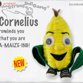 Handmade Cornelius String Doll Keychain with vibrant corn mascot design, featuring fabric tag and lobster clasp.