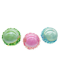 Three colorful bottom of Christmas ornaments on a white background