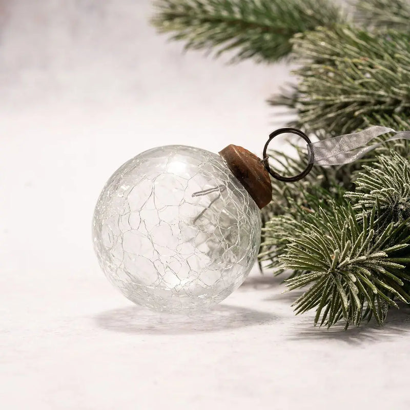 Clear crackle glass Christmas ornament with bronze cap and organza ribbon.

