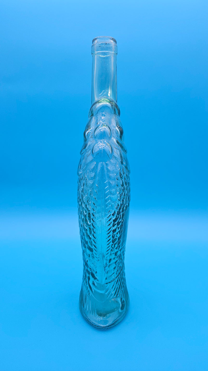 Vintage light green glass fish bottle