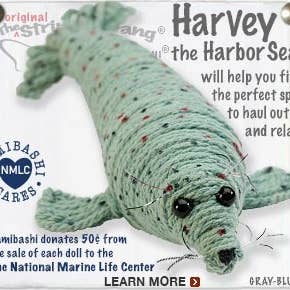 Handmade Harvey the Harbor Seal String Doll Keychain with a marine-inspired design, featuring a fabric tag and lobster clasp.