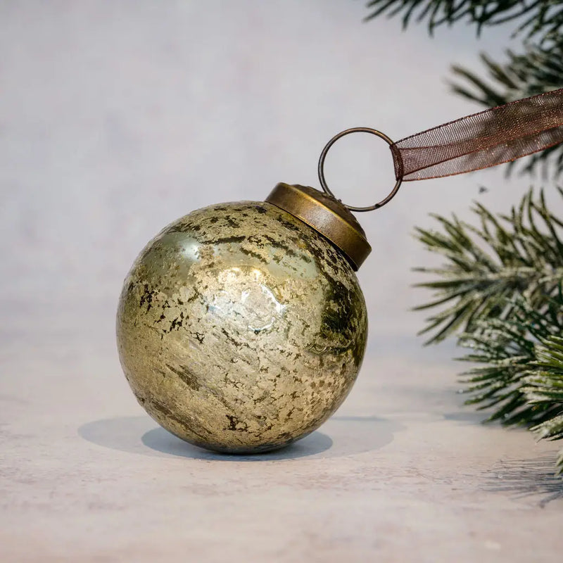 Gold antique foil glass Christmas bauble with bronze cap and organza ribbon.