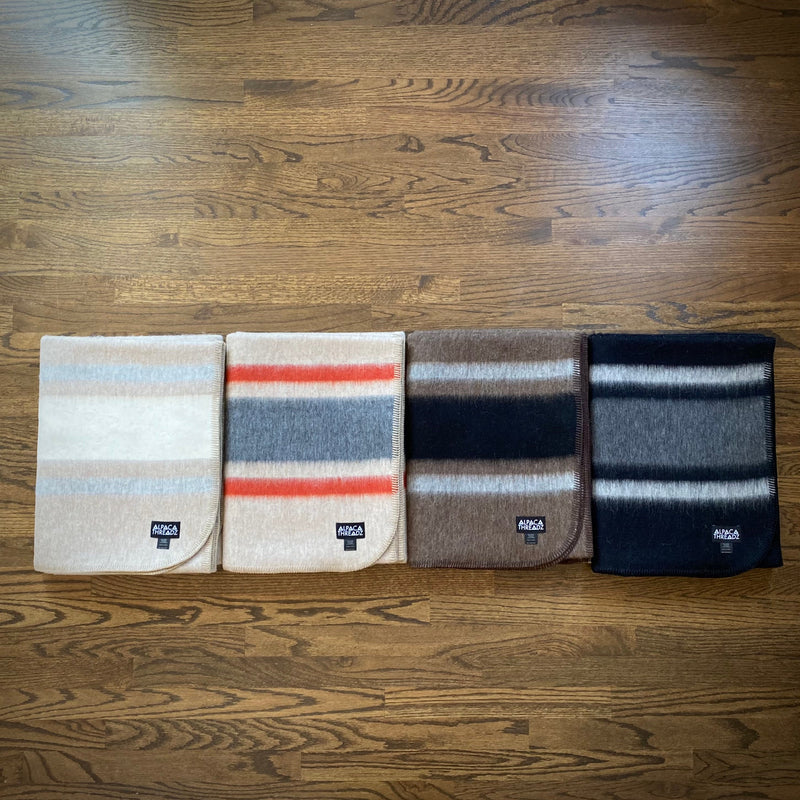 Collection of alpaca camp throws in assorted colors
