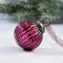 Hand-blown mulberry ribbed glass ball ornament with bronze cap and ribbon.