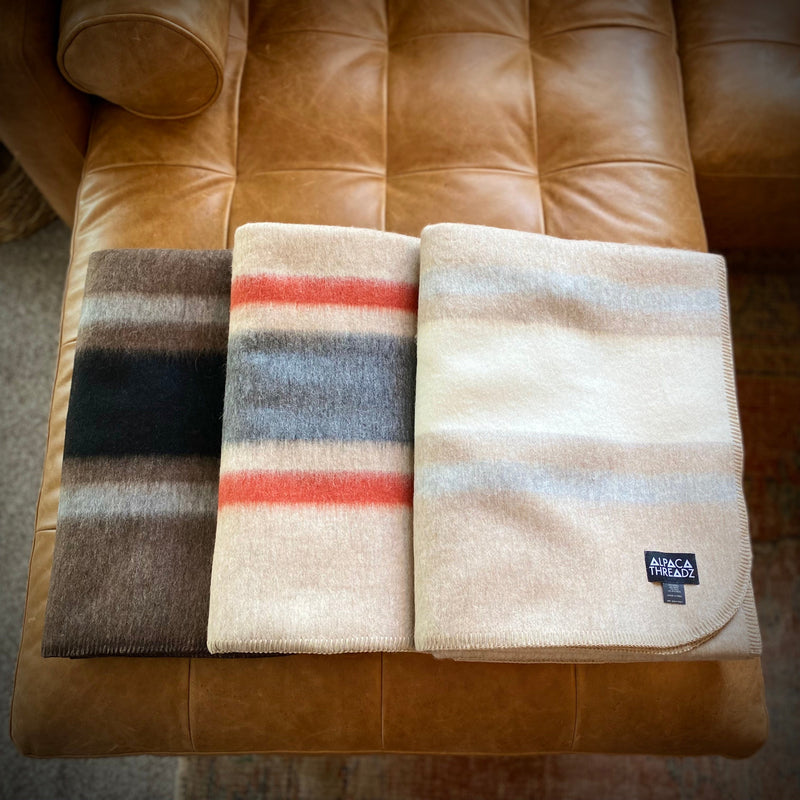 Collection of alpaca camp throws in assorted colors