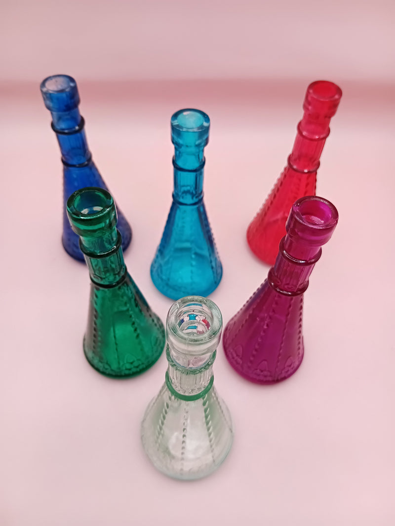 Miniature clear apothecary-style glass bottle with embossed design, no stopper, from Shell World