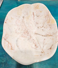 Large hand-carved onyx stone bowl with polished finish and creamy marbled tones in white, amber, and rose.