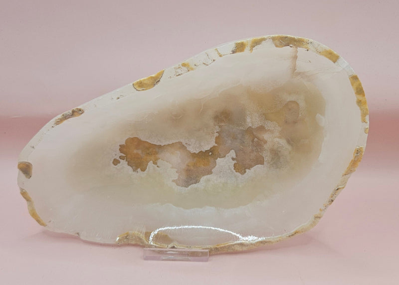 Raw-edge onyx dish with creamy polished interior 