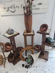 wooden plant stand with floral ceramic tile top and tiered shelves, 27.5 inches tall.