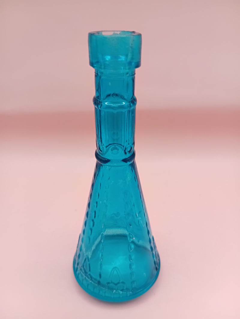 Miniature clear apothecary-style glass bottle with embossed design, no stopper, from Shell World