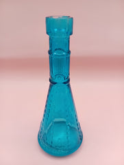 Miniature clear apothecary-style glass bottle with embossed design, no stopper, from Shell World