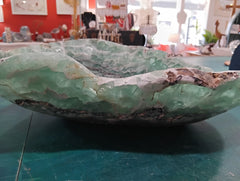 Carved green and purple fluorite crystal bowl with raw edge