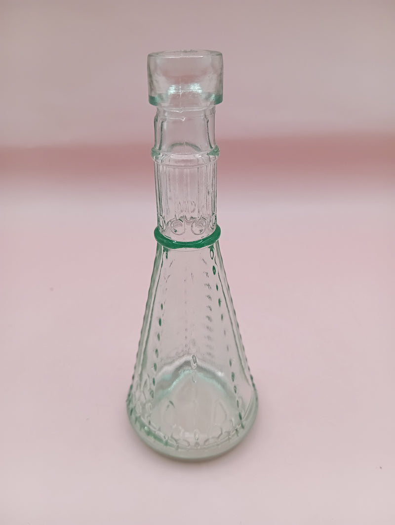 Miniature clear apothecary-style glass bottle with embossed design, no stopper, from Shell World