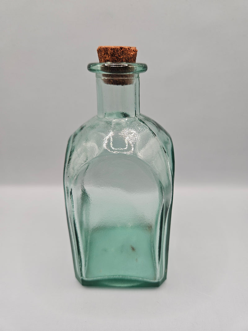 Vintage green glass bottle with cork stopper, 5.5 inches tall