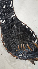 Large abstract wood and woven rattan sculpture with circular form and coil accents, 23.5