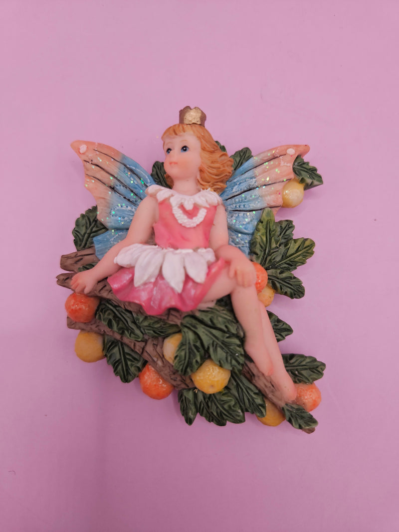 Fairy garden magnets with pastel wings and floral designs, each measuring approximately 3 inches.