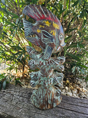 Colorful wooden sculpture of fish on coral, 20.25 inches by 8.5 inches, ideal for coastal and beach-inspired decor