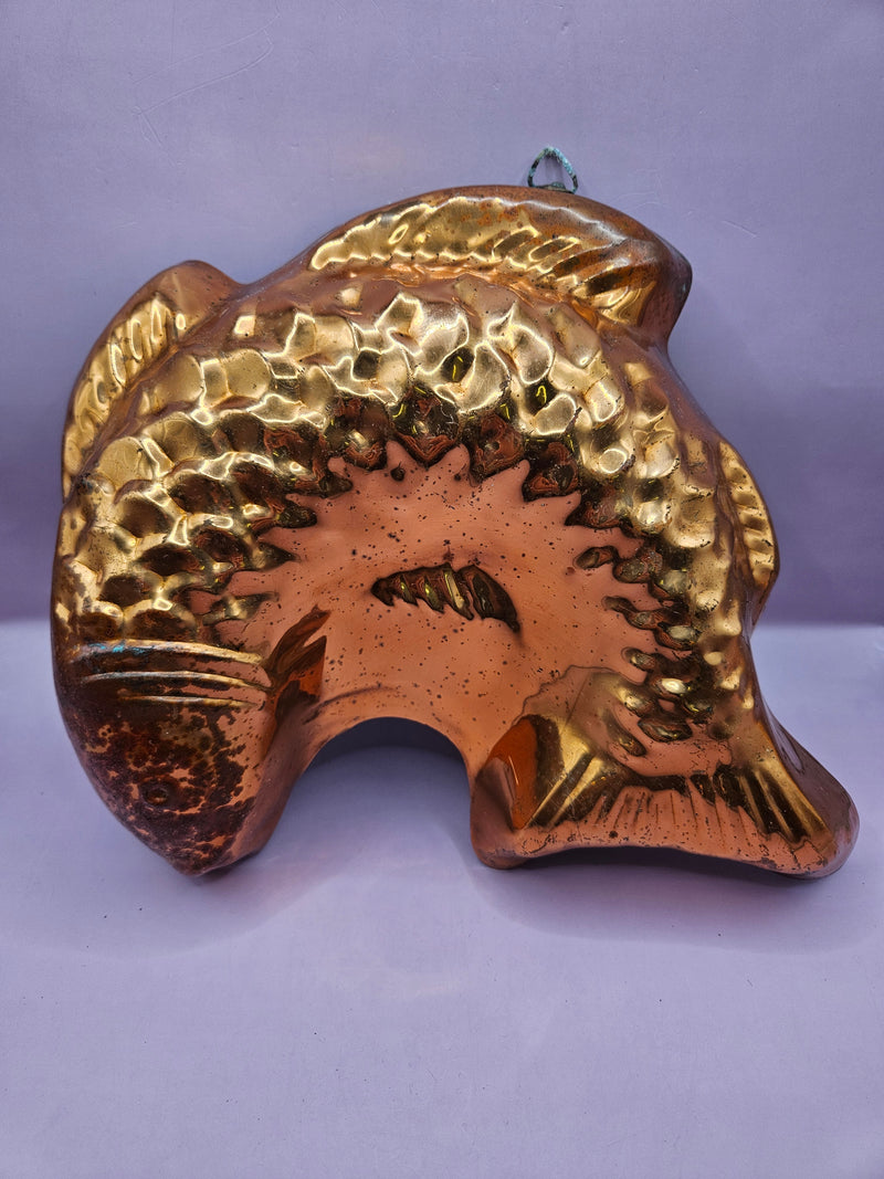 Vintage copper lobster mold showcasing polished finish and intricate details