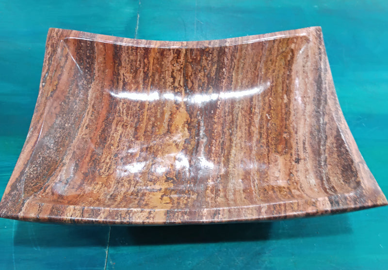 Hand-carved rust onyx rectangle bowl with flared sides and polished surface