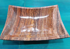 Hand-carved rust onyx rectangle bowl with flared sides and polished surface