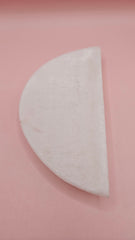 White onyx crescent-shaped shallow bowl with a polished finish.