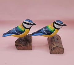 Hand-painted colorful songbird figurine on natural wood base, approx. 3.5