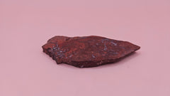 Moss Agate slab 22g, reddish with blue-white moss-like inclusions, 2.6x1.3 inches, photographed on pink background.
