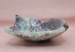 Polished fluorite crystal bowl with green banding, measuring 8 inches wide.