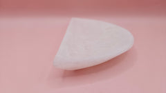 White onyx crescent-shaped shallow bowl with a polished finish.