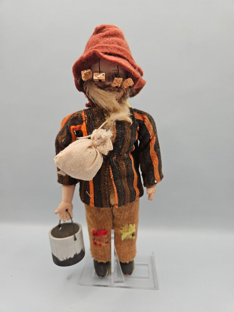 Close-up view of a vintage 8" Australian miner swagman doll, featuring a traditional hat, rugged clothing, and swag bag. The doll is a perfect representation of the iconic Australian Outback style.