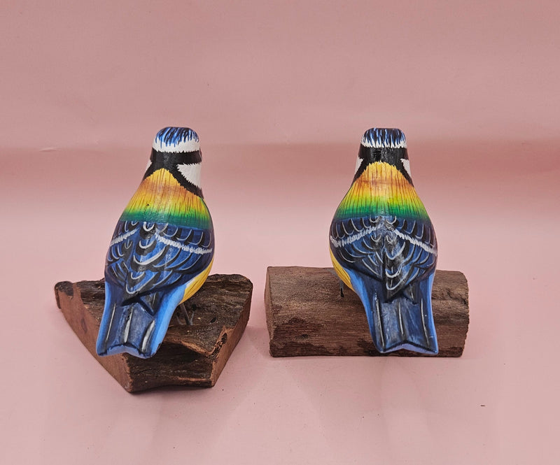 Hand-painted colorful songbird figurine on natural wood base, approx. 3.5"–4.5" tall.