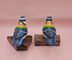 Hand-painted colorful songbird figurine on natural wood base, approx. 3.5