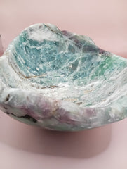 and-carved fluorite bowl featuring layers of green, purple, and aqua crystal