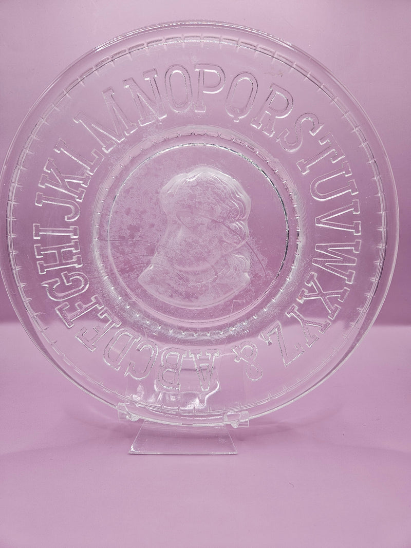  Vintage clear pressed glass child’s plate with alphabet border and cameo design, 8 inches.