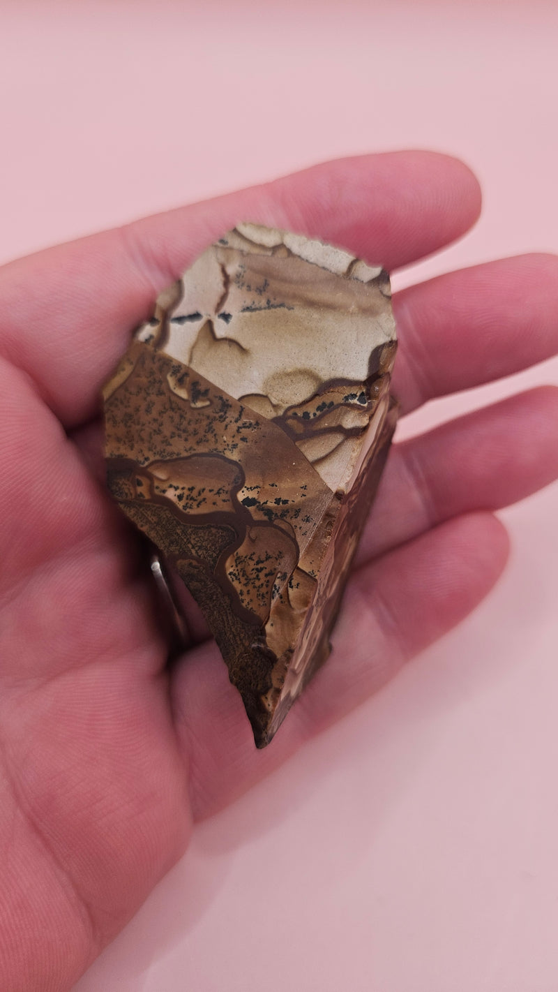 Rough Deschutes Jasper specimen with scenic brown and gold banding, 38g collector’s stone from Oregon shown in hand.
