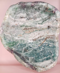 and-carved fluorite bowl featuring layers of green, purple, and aqua crystal