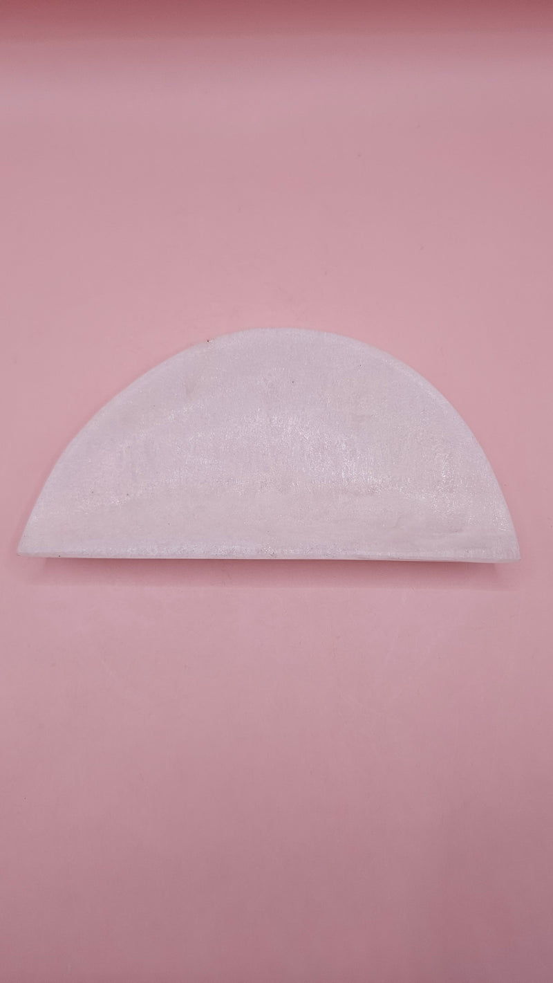 White onyx crescent-shaped shallow bowl with a polished finish.