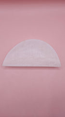 White onyx crescent-shaped shallow bowl with a polished finish.
