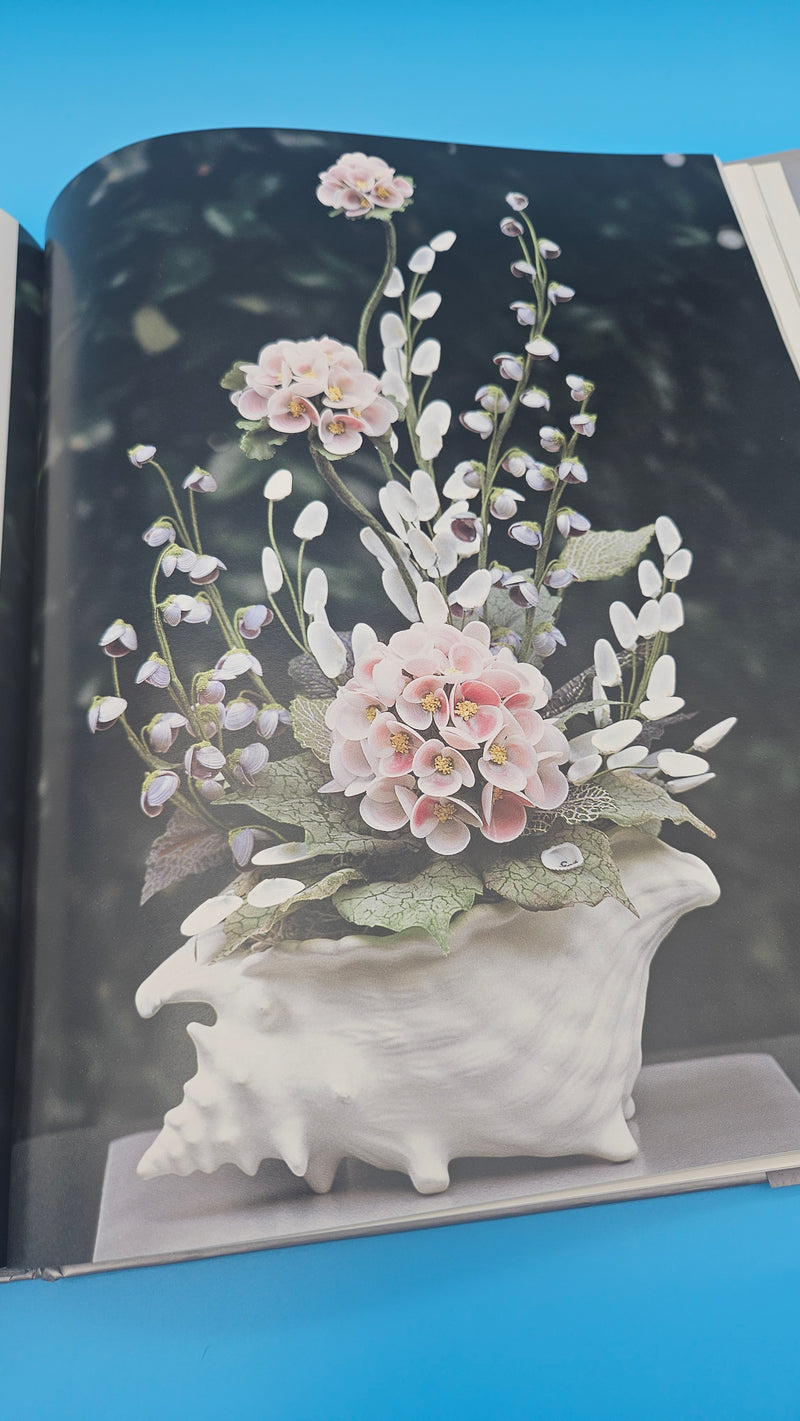 Shell Chic hardcover book by Marlene Hurley Marshall, coastal décor guide featuring seashell-decorated projects, photography by Sabine Vollmer von Falken, 2002 Storey Publishing edition.