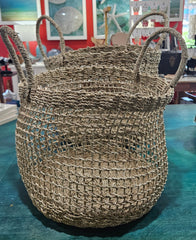 handwoven seagrass baskets in small and large sizes with open-weave mesh design and sturdy handles