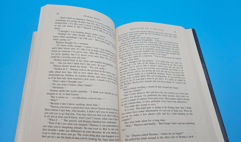 1998 hardcover edition of Message in a Bottle by Nicholas Sparks with dust jacket showing sailboat on ocean waves.