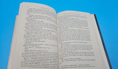 1998 hardcover edition of Message in a Bottle by Nicholas Sparks with dust jacket showing sailboat on ocean waves.