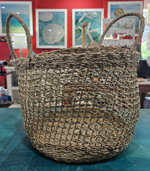 handwoven seagrass baskets in small and large sizes with open-weave mesh design and sturdy handles