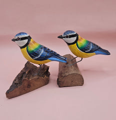 Hand-painted colorful songbird figurine on natural wood base, approx. 3.5