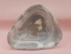 Polished natural onyx shell bowls with layered cream, gray, and brown tones