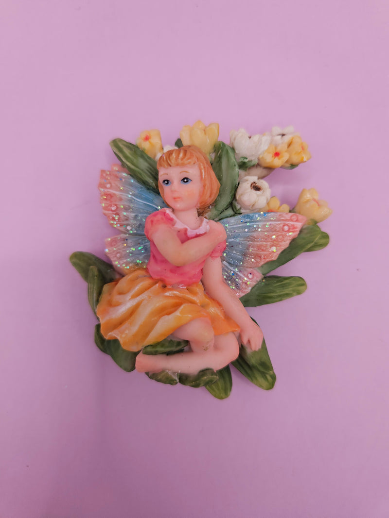 Fairy garden magnets with pastel wings and floral designs, each measuring approximately 3 inches.