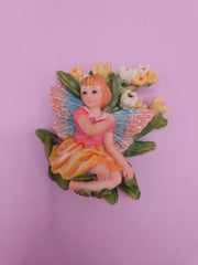 Fairy garden magnets with pastel wings and floral designs, each measuring approximately 3 inches.