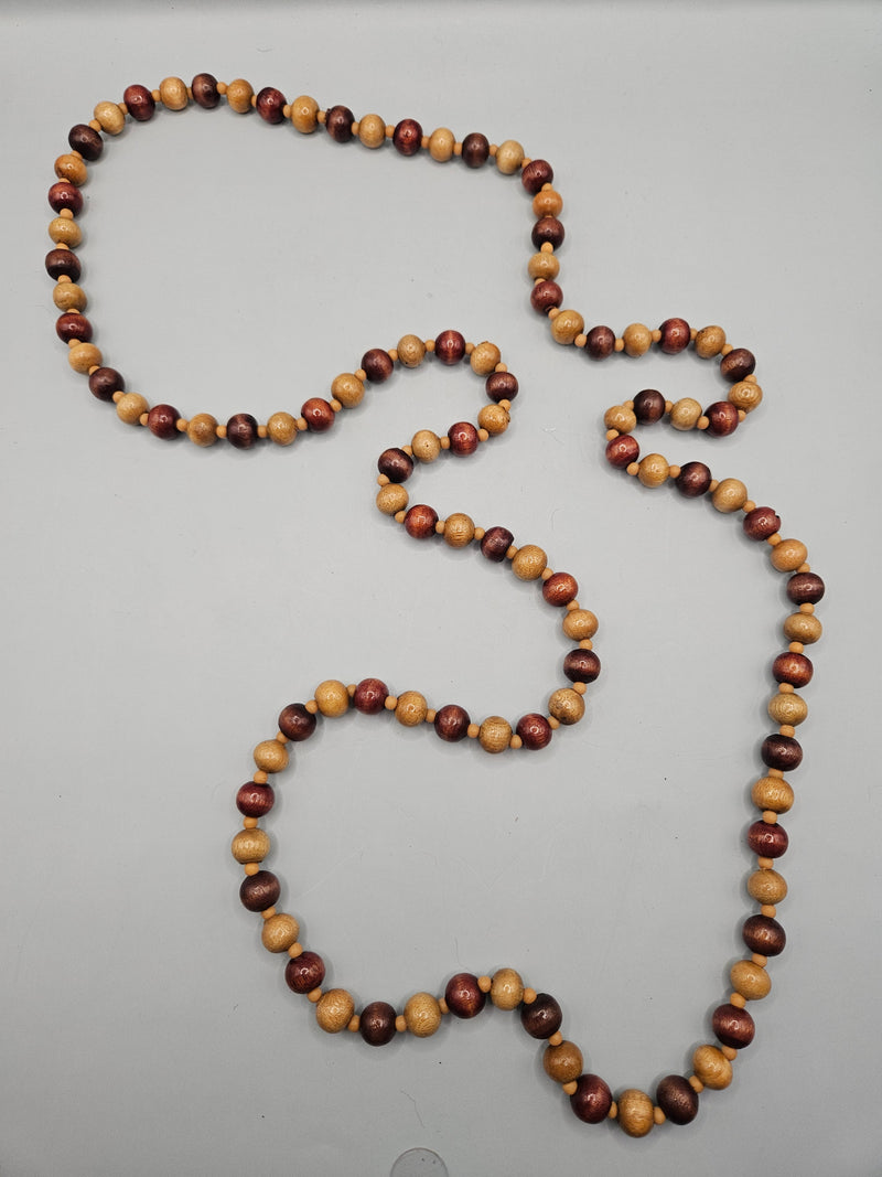 A vintage 24" wood bead necklace featuring natural wooden beads in a boho style